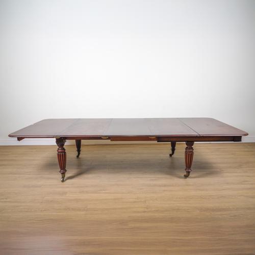 L DUCHESENE; A REGENCY STYLE MAHOGANY EXTENDING DINING TABLE