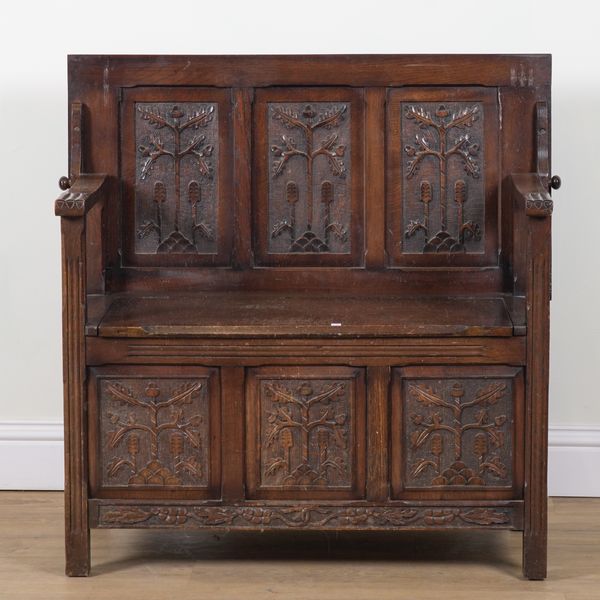 A MID 20TH CENTURY OAK MONK'S BENCH