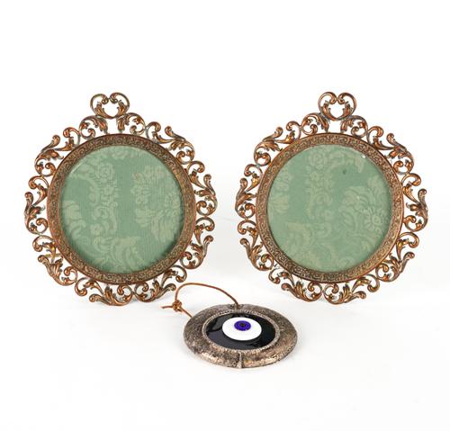 A PAIR OF EMBOSSED COPPER SCROLLING FOLIATE PHOTOGRAPH FRAMES (3)