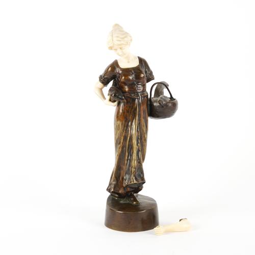 PETER TERESZCZUK (UKRAINIAN-AUSTRIAN 1875-1963): AN ART NOUVEAU BRONZE AND IVORY MOUNTED FIGURE OF A FEMALE WITH BASKET AND GAME BIRDS