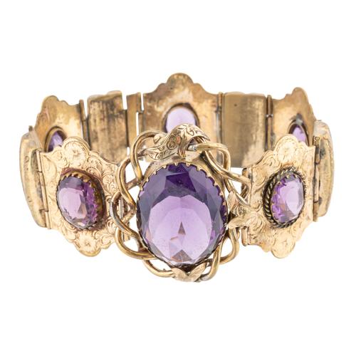 A VICTORIAN GILT METAL AND MAUVE PASTE SET BRACELET