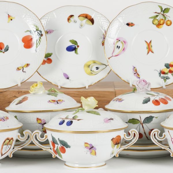 A SET OF TWELVE HEREND 'MARKET GARDEN' PATTERN OZIER MOULDED SOUP CUPS, COVERS AND STANDS (36)