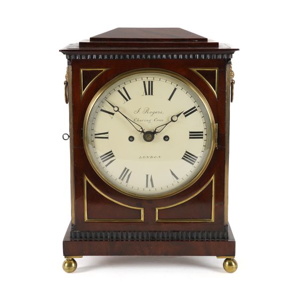 A REGENCY MAHOGANY MANTEL CLOCK AND BRACKET (2)