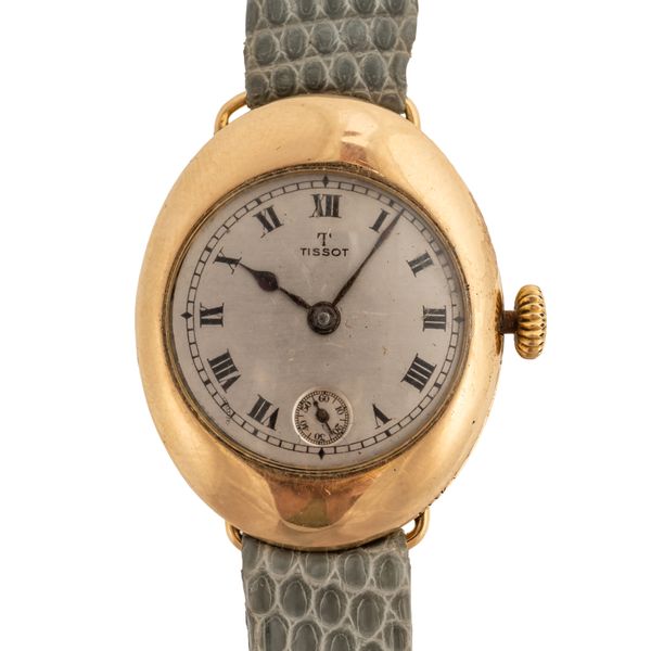 A TISSOT 18CT GOLD OVAL CASED LADY'S WRISTWATCH