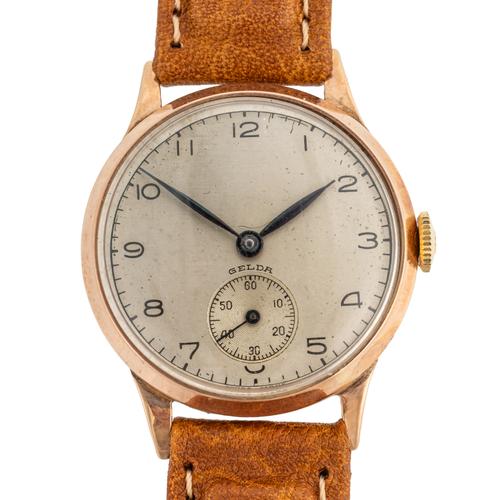 A GELDA 9CT GOLD CIRCULAR CASED GENTLEMAN'S WRISTWATCH