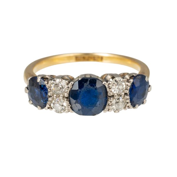 A GOLD AND PLATINUM, SAPPHIRE AND DIAMOND RING