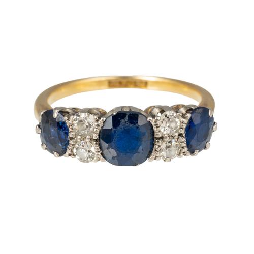 A GOLD AND PLATINUM, SAPPHIRE AND DIAMOND RING