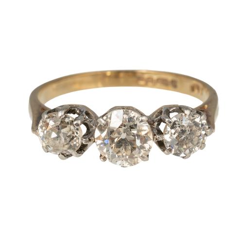 A 9CT GOLD AND DIAMOND THREE STONE RING