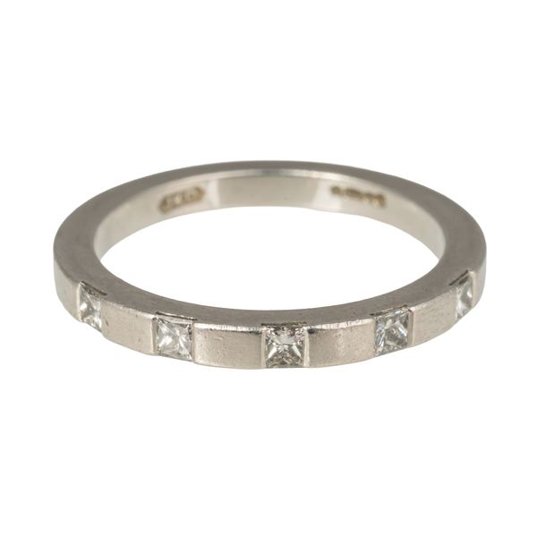 A PLATINUM AND DIAMOND FIVE STONE BAND RING