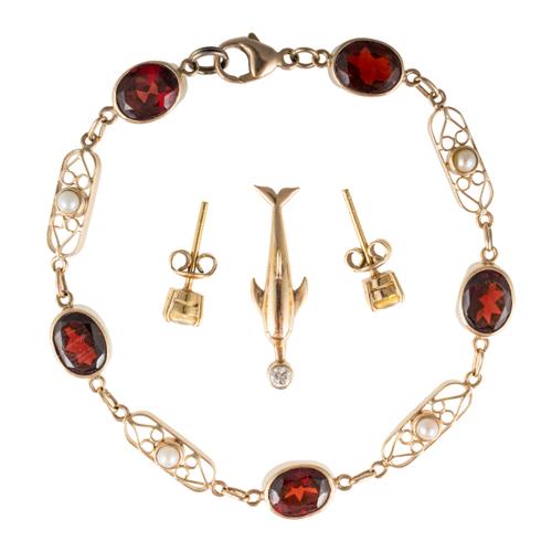 A GOLD, GARNET AND HALF PEARL BRACELET, A PAIR OF GOLD AND YELLOW SAPPHIRE SET EARSTUDS AND A GOLD AND DIAMOND DOLPHIN PENDANT (4)