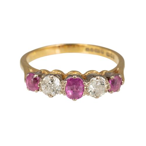 AN 18CT GOLD, RUBY AND DIAMOND SET FIVE STONE RING