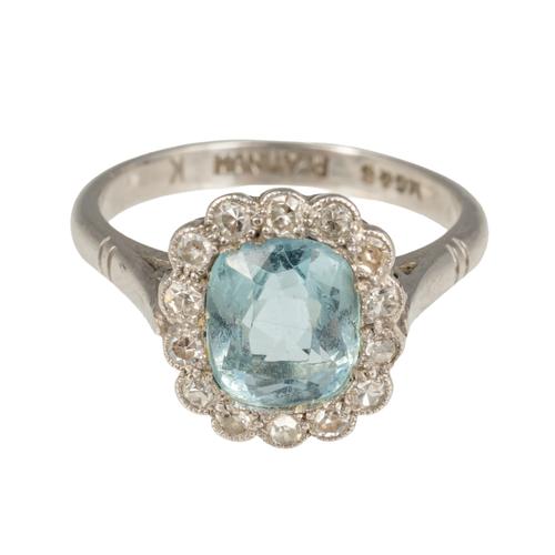 A PLATINUM, AQUAMARINE AND DIAMOND RING