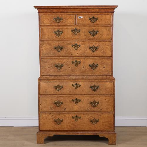 A GEORGE II FEATHER BANDED BURR ELM CHEST ON CHEST
