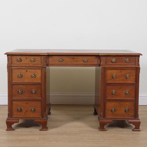 AN EDWARDIAN MAHOGANY INVERTED BREAKFRONT PEDESTAL DESK