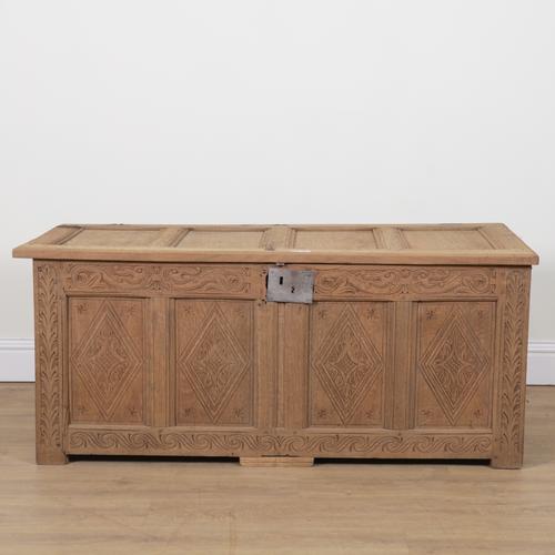 AN 18TH CENTURY AND LATER CARVED OAK COFFER