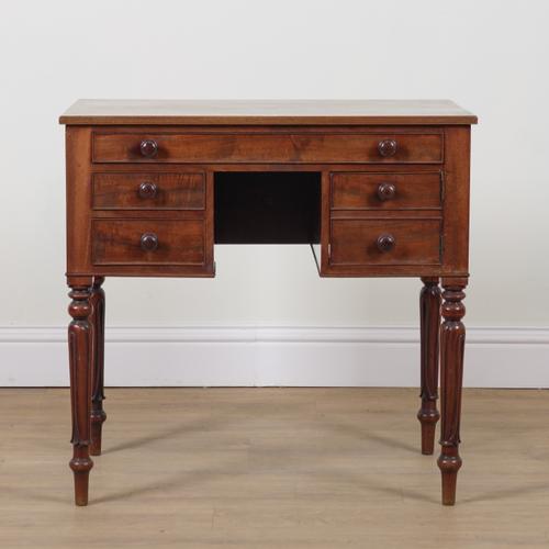A VICTORIAN MAHOGANY KNEEHOLE WRITING DESK
