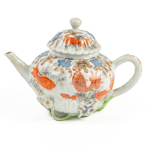 A CHINESE EXPORT `CHRYSANTHEMUM' MOULDED TEAPOT AND COVER (2)