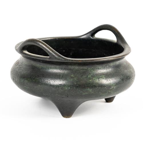 A CHINESE BRONZE TRIPOD CENSER