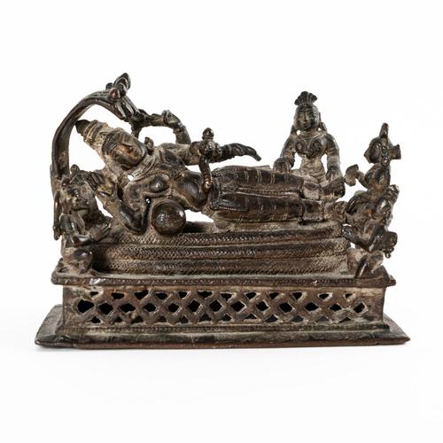 A BRONZE FIGURE OF VISHNU RECLINING ON THE SERPENT RAFT