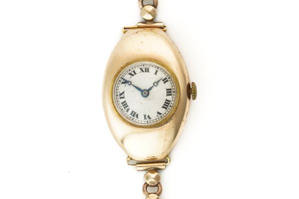 A LONGINES GOLD OVAL CASED LADY'S WRISTWATCH