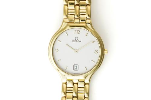 OMEGA DE VILLE SYMBOL. AN 18K GOLD QUARTZ CALENDAR BRACELET WRISTWATCH