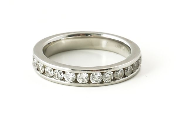 A PLATINUM AND DIAMOND HALF ETERNITY RING