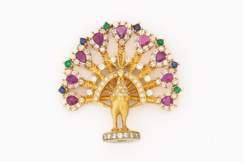A YELLOW GOLD AND VARICOLOURED GEMSTONE PEACOCK BROOCH