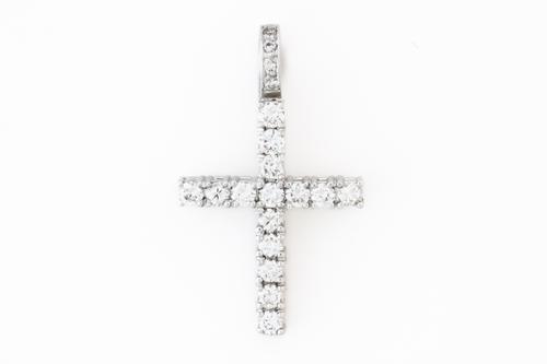 A WHITE GOLD AND DIAMOND PENDANT CROSS