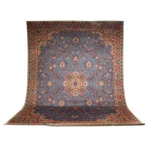 A  LARGE MACHINE WOVEN CARPET