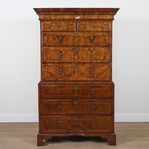 A MID 18TH CENTURY AND LATER FIGURED WALNUT CHEST ON CHEST