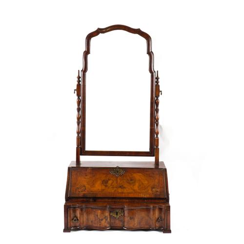 AN EARLY 18TH CENTURY FEATHER BANDED WALNUT DRESSING TABLE MIRROR