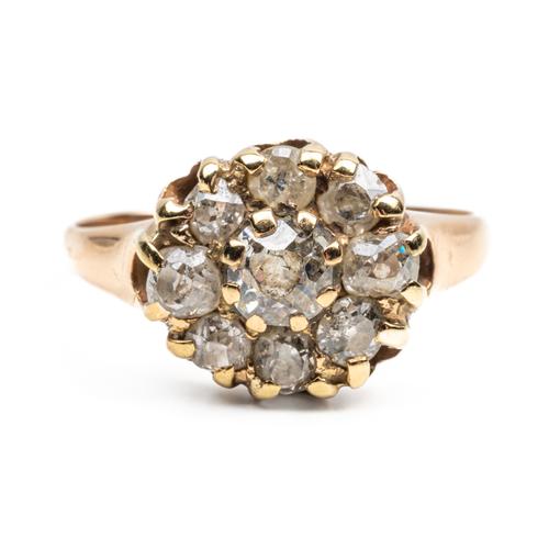 A GOLD AND DIAMOND NINE STONE CLUSTER RING