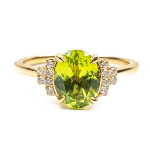 A PERIDOT AND DIAMOND RING