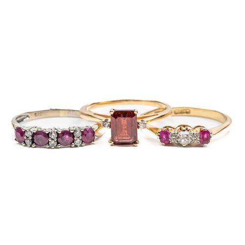 THREE RED GEM SET RINGS (3)