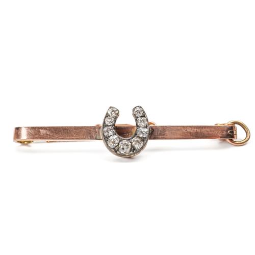 A GOLD AND DIAMOND BAR BROOCH