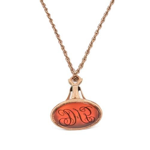 A GOLD AND CORNELIAN FOB SEAL WITH A GOLD MULTIPLE LINK NECKCHAIN