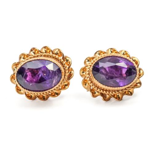 A PAIR OF 9CT GOLD AND AMETHYST SINGLE STONE EARSTUDS