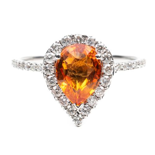 AN ORANGE SAPPHIRE RING