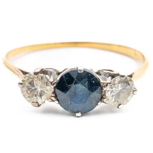 A GOLD SAPPHIRE AND DIAMOND THREE STONE RING