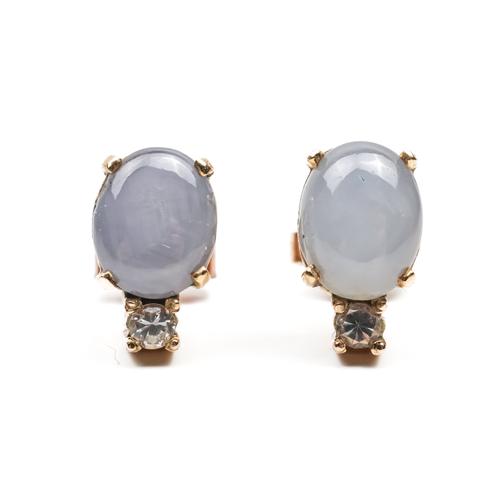 A PAIR OF CABOCHON SAPPHIRE AND COLOURLESS GEM SET EARSTUDS