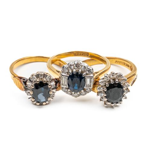 THREE 18CT SAPPHIRE AND DIAMOND CLUSTER RINGS (3)