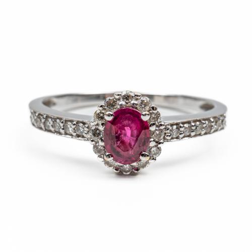A WHITE GOLD, RUBY AND DIAMOND CLUSTER RING