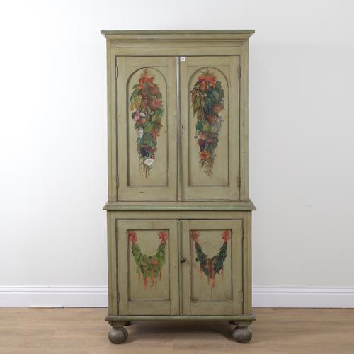 AN EARLY 19TH CENTURY LATER GREEN AND FLORAL POLYCHROME PAINTED DOUBLE HEIGHT CUPBOARD