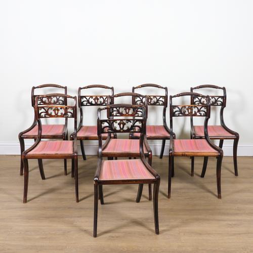 A SET OF EIGHT REGENCY STAINED BEECH BAR BACK DINING CHAIRS (8)
