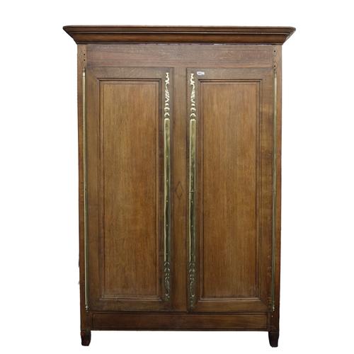A 19TH CENTURY FRENCH OAK TWO DOOR ARMOIRE