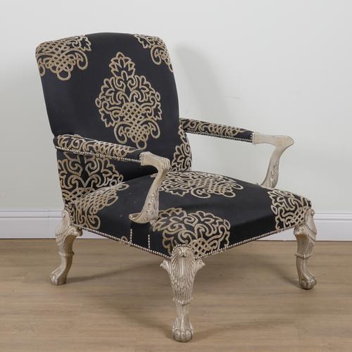 ANDREW MARTIN; A WHITE PAINTED OPEN ARMCHAIR