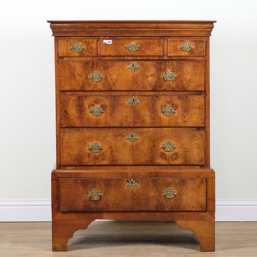 A MID 18TH CENTURY FIGURED WALNUT CHEST ON STAND