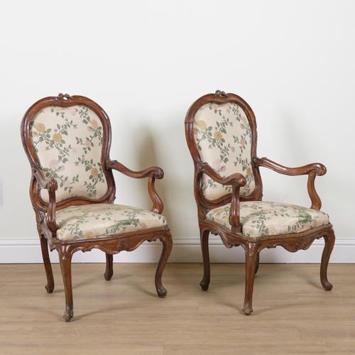 A PAIR OF LOUIS XV WALNUT FRAMED OPEN ARMCHAIRS (2)