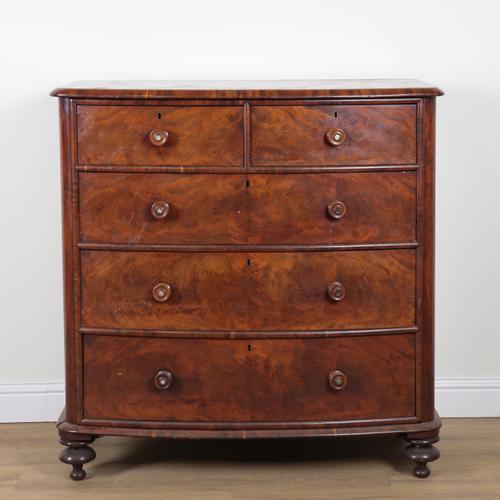 A MID VICTORIAN MAHOGANY BOWFRONT CHEST OF DRAWERS
