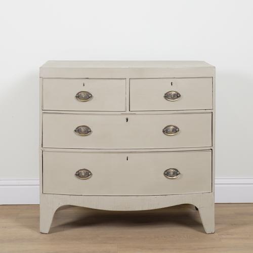 A REGENCY LATER PAINTED BOWFRONT CHEST OF DRAWERS